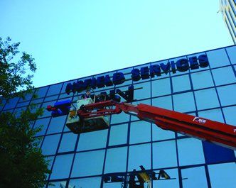 workers installing sign